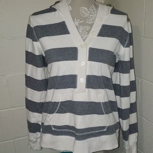 Striped gray and cream hoodie with pockets.
